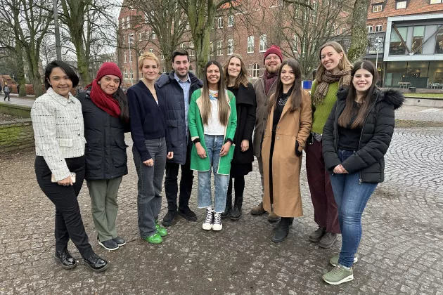 A group photo with ten people, outdoors. Photo